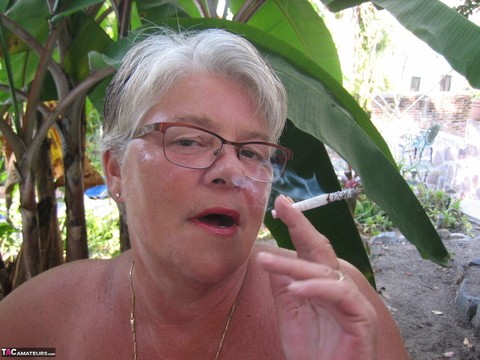 Old woman Girdle Goddess smokes before exposing her fat body on her patio | Фото 5