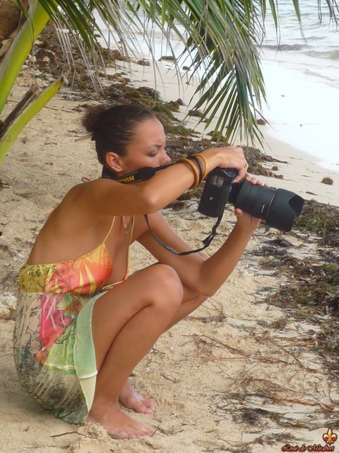 Swimsuit models Melisa Mendini and Marie go topless on a tropical beach