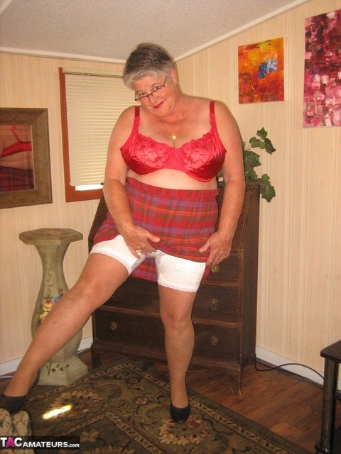 Old amateur Girdle Goddess plays with a sex toy while disrobing by herself | Фото 9