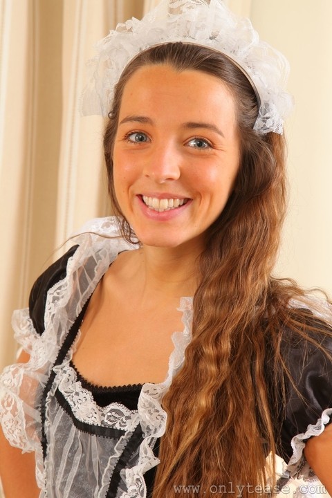 Adorable brunette maid Esmee takes off her uniform and shows her hot figure | Фото 1