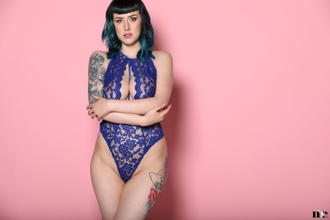 Inked model Lisha Blackhurst unleashes her boobs while posing in a bodysuit