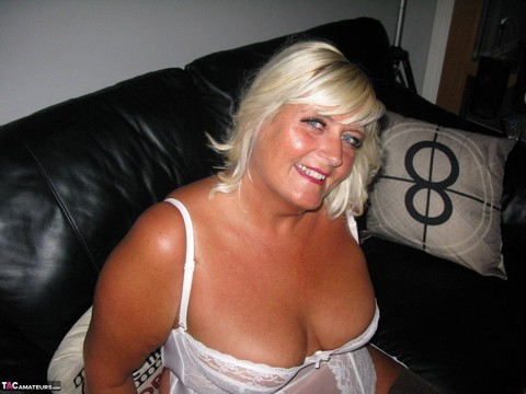 Overweight blonde Chrissy Uk exposes herself in white lingerie and nylons | Фото 1