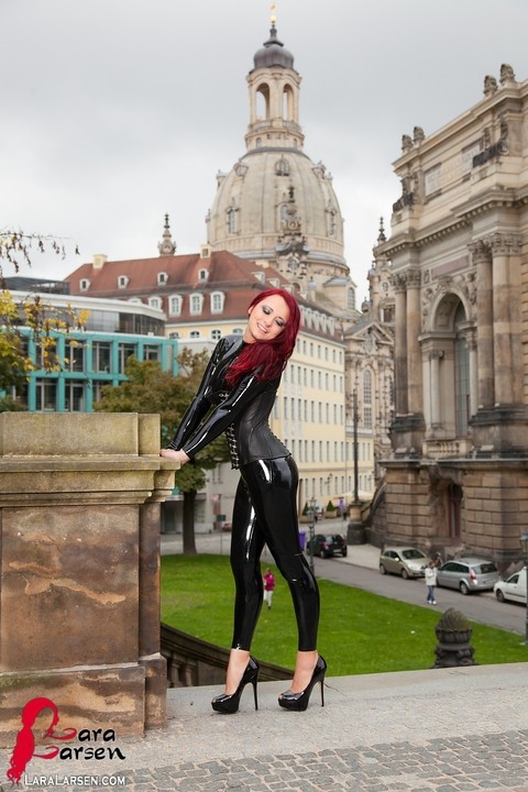 Clothed redhead Lara Larsen models latex attire and high heels in public | Фото 4