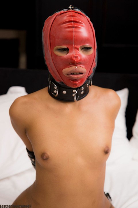 Ball gagged Asian girl Abraxas is fitted with a mask & collar while restrained | Фото 11