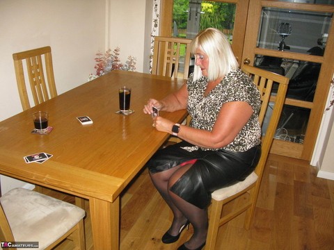 Mature blonde BBW Chrissy Uk loses her clothing while playing strip poker