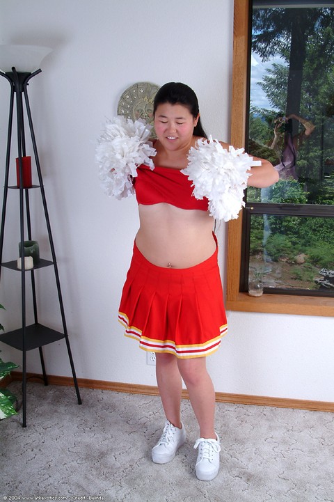 Chubby Asian first timer baring small boobs while shedding cheer uniform | Фото 2