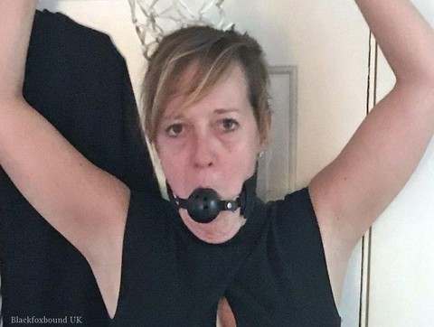 Mature lady Meyer is fitted with a ball gag and nipple clamps while restrained | Фото 8