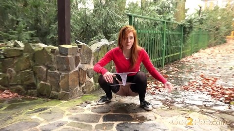 Redhead Sandra lifts her skirt to take a long hot pee in public | Фото 12