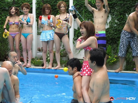 Japanese beauties lose their bikinis during wrestling match in a swimming pool