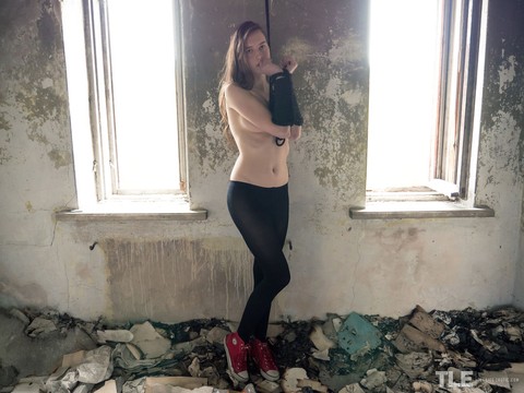 Teen model Martha rips open her pantyhose in an abandoned building | Фото 1