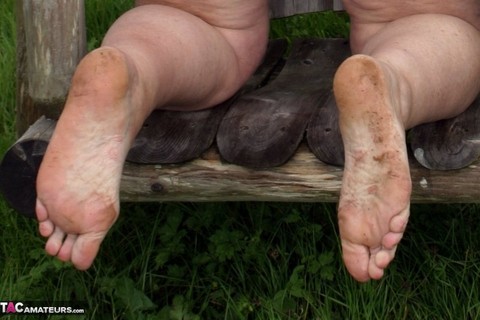 Old British woman Grandma Libby exposes her boobs on a backyard bench swing