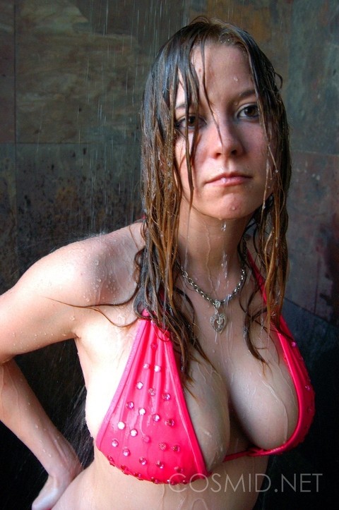 Amateur model Lisa Marie gets soaking wet while filling out a pink bikini