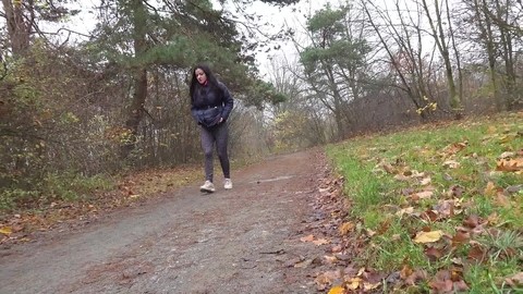 Brunette chick Helen takes a piss on a gravel path during a walk in the woods | Фото 13