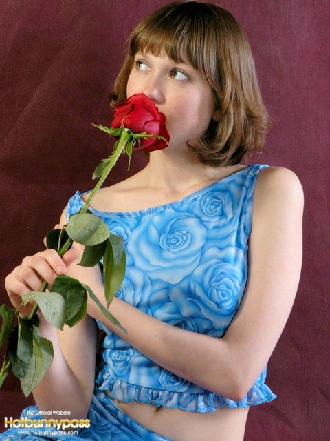 Adorable teen Anabell sniffs a red rose before taking off her clothes | Фото 2