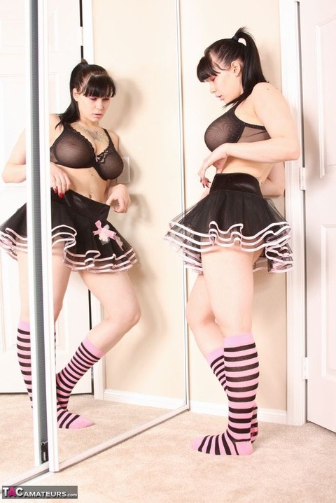 Busty amateur Susy Rocks models non nude afore mirror in skirt and socks | Фото 15