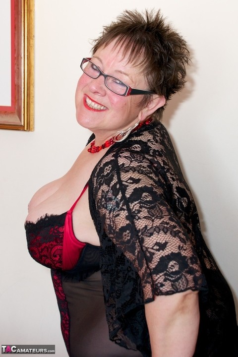 Fat older woman Warm Sweet Honey dildos her pussy in lingerie and glasses | Фото 9