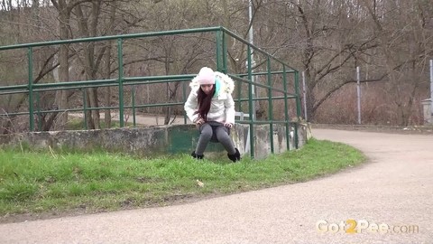 Clothed girl Mistica squats for a pee beside the road in winter clothing | Фото 13