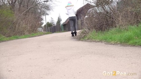 Clothed girl Mistica squats for a pee beside the road in winter clothing | Фото 15