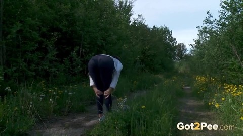 Caucasian chick Kristina pulls her pants down to take a piss on a rural path | Фото 13