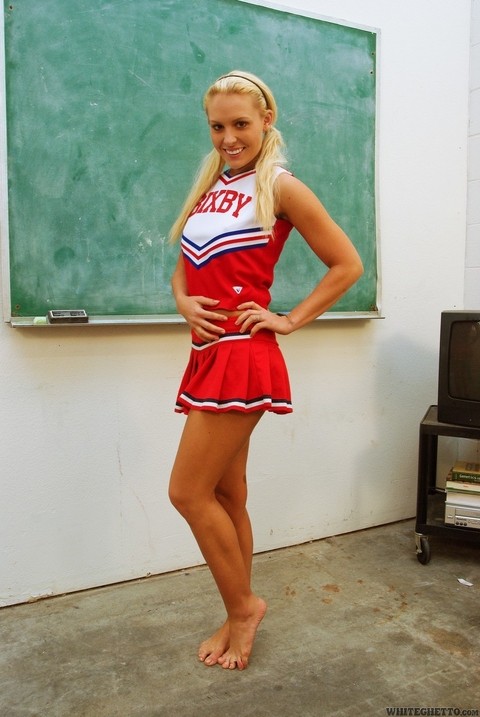 Blonde babe Jamey James flashing upskirt panties in cheerleader uniform