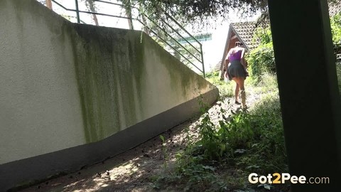 Dark haired girl Eveline Neill squats for a piss behind a building | Фото 15