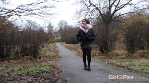 Caucasian girl Lera pulls down her hose on a chilly day for a piss by a tree | Фото 1