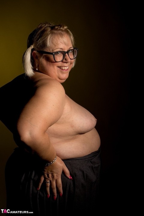 Blonde fatty Lexie Cummings touches her small breasts while wearing glasses