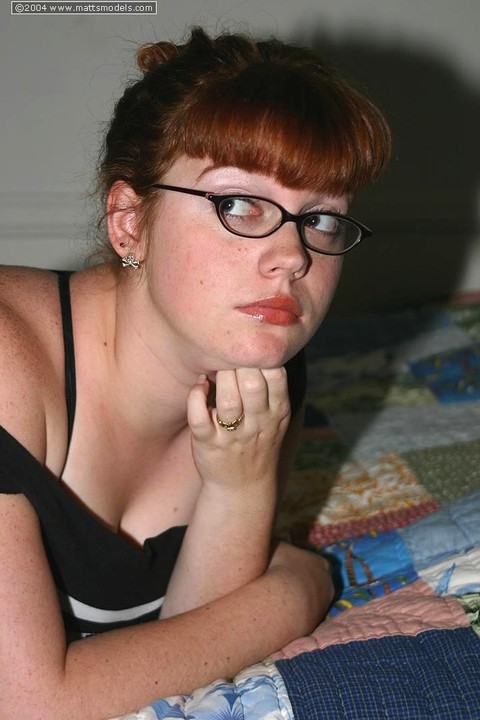 Chubby nerd with red hair takes off her glasses after uncupping big naturals