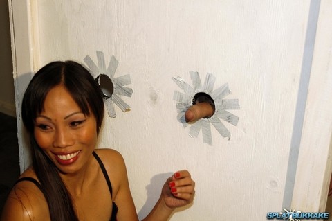 Asian slut Filipino Faye sucks the cum from multiple cocks at a gloryhole | Фото 1