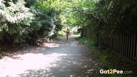 Natural blonde Lickylex gets passed by a cyclist while peeing on the road | Фото 1