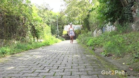 Distressed girl Chloe Lamour takes a piss on a cobblestone walkway | Фото 1