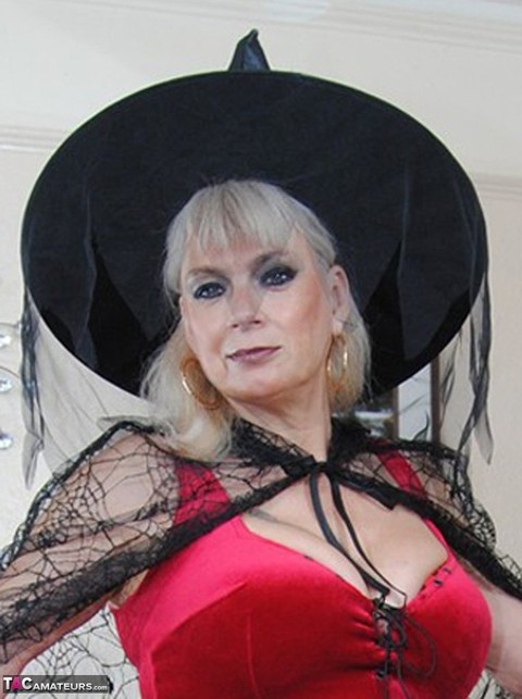 Middle-aged platinum blonde Dimonty models lingerie and a witch's hat | Фото 3