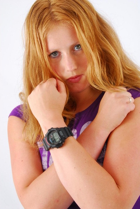 Natural redhead Judy models a black G-Shock watch while fully clothed | Фото 11