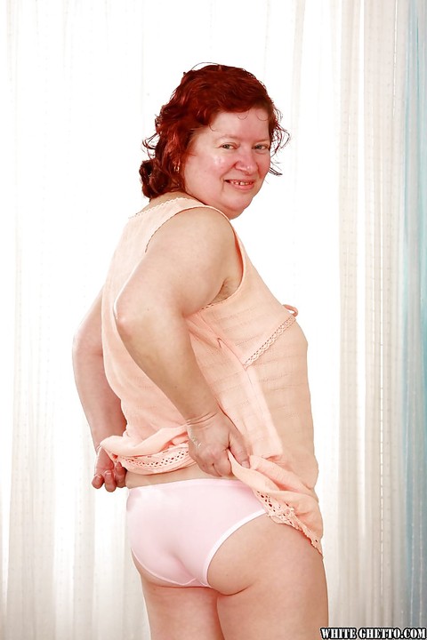 Fatty redhead granny with massive jugs stripping off her clothes | Фото 3