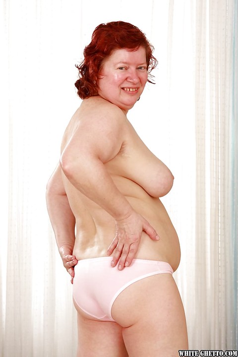 Fatty redhead granny with massive jugs stripping off her clothes | Фото 5