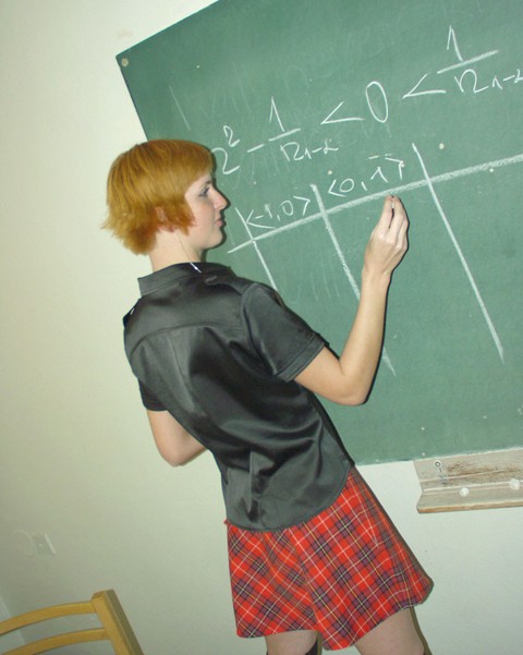 Redheaded student Strelka strips in the classroom and touches her hot body | Фото 1