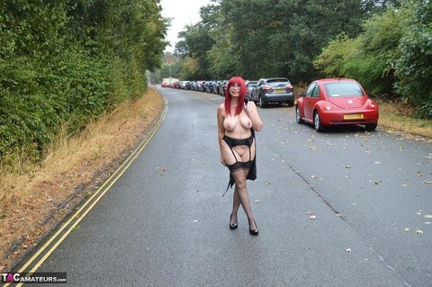 Mature redhead Barby Slut gets naked in public places on a wet day | Фото 15