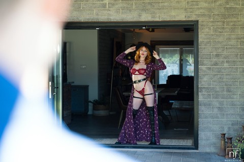 Sexy redhead Lacy Lennon seduces her man in a cape and lingerie plus OTK boots | Фото 1