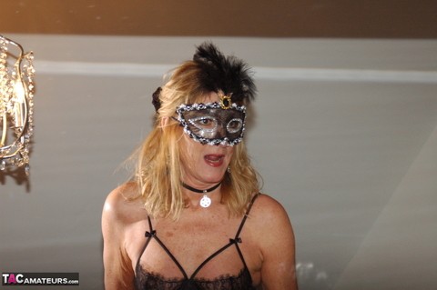 Older amateur removes a mask while wearing sheer lingerie and tan nylons | Фото 2