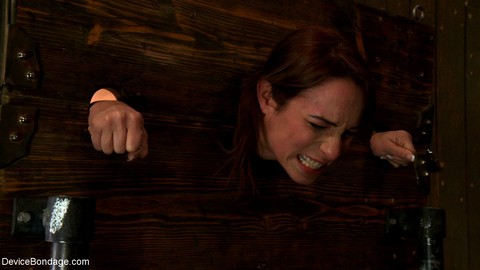 Skinny pornstar Amber Rayne gets fisted & fucked while restrained in a pillory | Фото 5