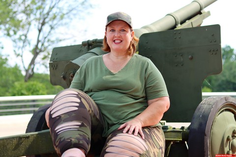 Obese amateur Goddess Pear models for a SFW shoot on an artillery gun in camo | Фото 11