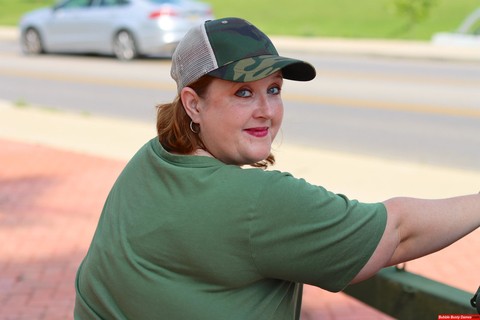 Obese amateur Goddess Pear models for a SFW shoot on an artillery gun in camo