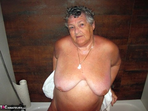 Obese amateur Grandma Libby blow drys her hair after taking a shower | Фото 14