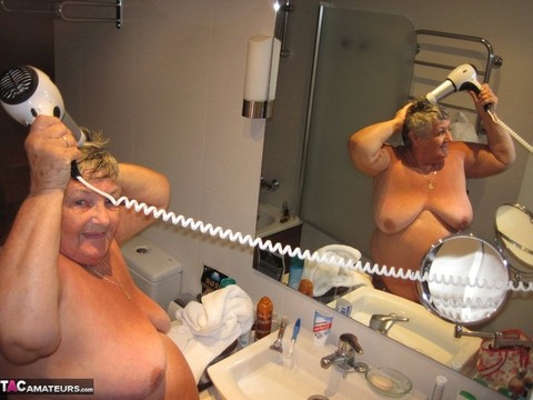 Obese amateur Grandma Libby blow drys her hair after taking a shower | Фото 17