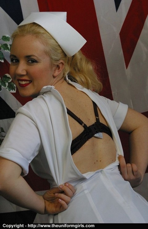 Chubby blonde nurse removes her uniform before baring tits and twat in nylons | Фото 6