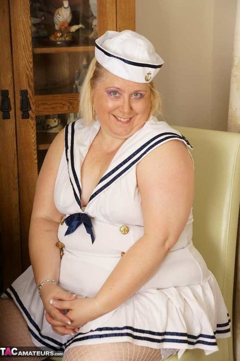 Blonde BBW Lexie Cummings plays with her pierced pussy in a sailor uniform | Фото 1