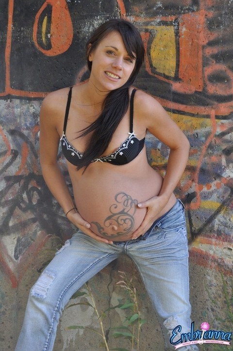 Pregnant solo girl Brianna shows her small tits and belly bump in faded jeans | Фото 5