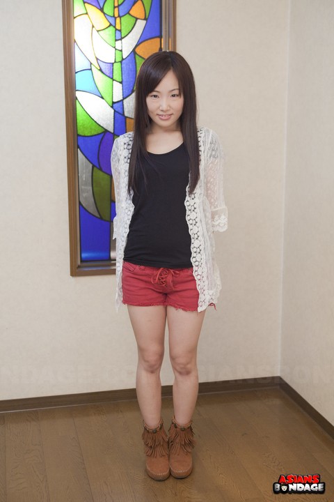 Innocent Japanese babe poses in her cute red short at the casting | Фото 5