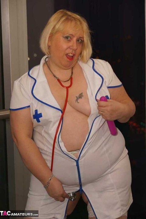 Obese blonde nurse Lexie Cummings masturbates on a sofa with a vibrator