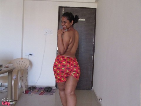 Topless Indian woman begins to pull down her shorts and underwear | Фото 10